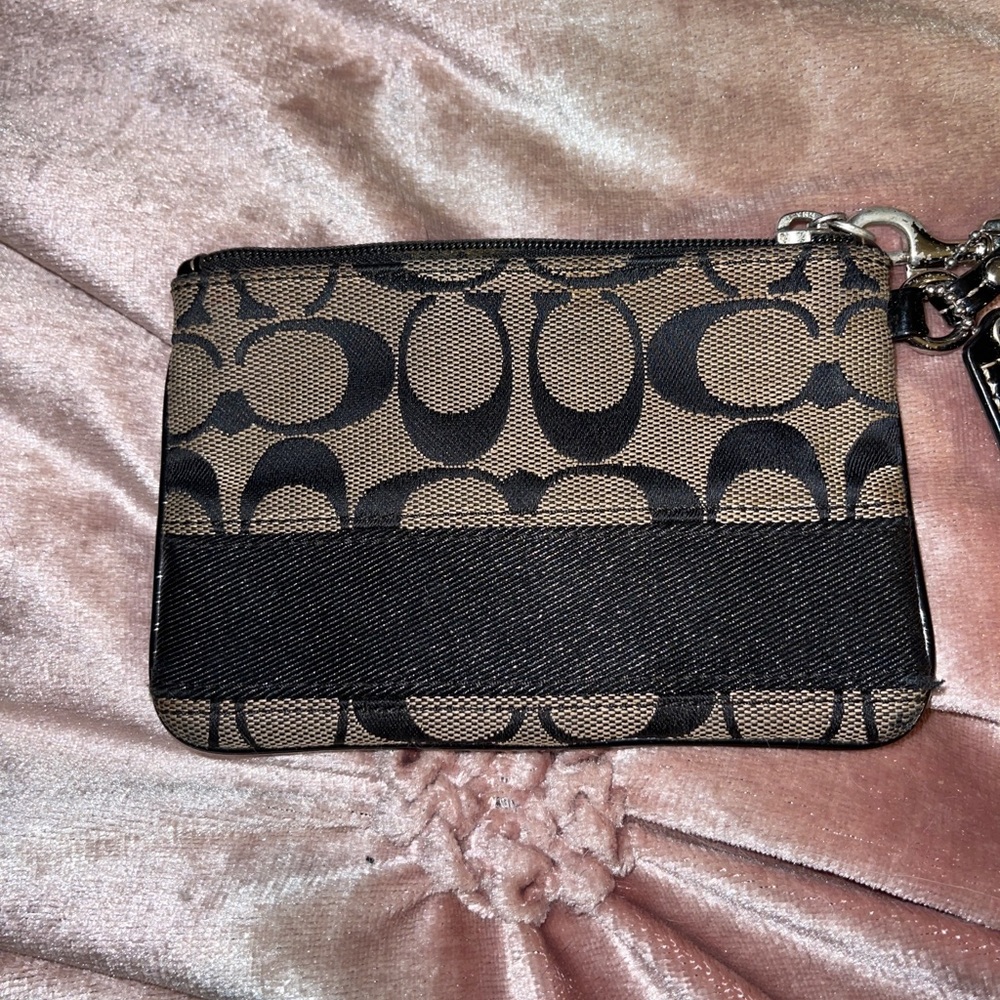 Coach Signature Wristlet.